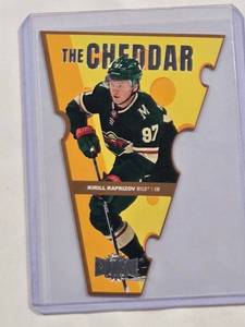 lot 249 image: Kirill Kaprizov 2021-22 Metal Universe Die Cut The Cheddar TC-7