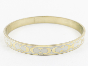 lot 5A image: Coach  Retro Enameled Coach Logo Gold Plated Bangle Bracelet. Comes With Coach Fabric Bag