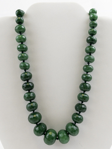 lot 13 image: Natural Facted Emerald Gold Tone Base Metal Bead Necklace. Estimated Replacement Value $600