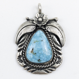 lot 35A image: IC (Native American)  Turquoise Floral Setting sterling silver pendant.