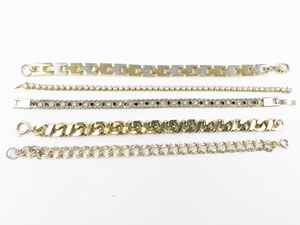 lot 143 image: Group of 5  Gold Tone Base Metal  Bracelets With A Variety Of Different Styles..