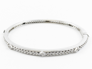 lot 150 image: Gorgeous Natural Diamond Sterling Silver Hinged Bangle.