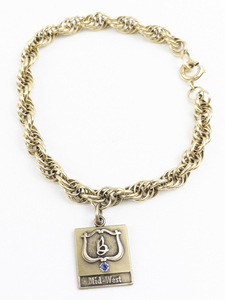 lot 156 image: Jostens B, Midwest Gold Filled Charm Bracelet.