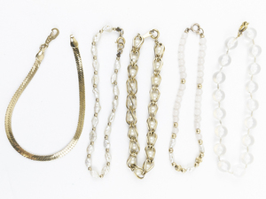 lot 169 image: Group of 5  Cute Beaded Trendy Gold Tone Base Metal Bracelets.