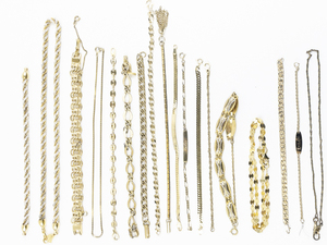 lot 170 image: Group Of 17 Various Style Gold Tone Base Metal Bracelets .