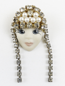lot 196 image: Rhinestone Accented Flapper Girl Gold Tone Base Metal Brooch .