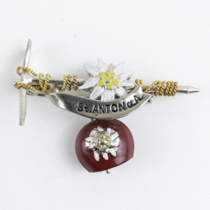 lot 208 image: Vintage St. Anton. A Two-Tonebase Metal Brooch With Red Dangle Bell.
