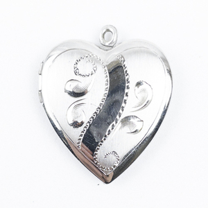 lot 214 image: Etched Heart sterling silver locket.