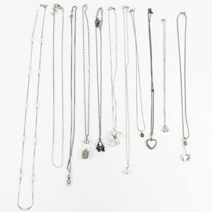 lot 271 image: Group of 10 Silver Tone Base Metal Pendant Necklaces.