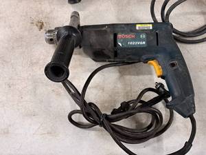lot 580 image: Bosch 38 Drill 1023VSR with Black Side Handle