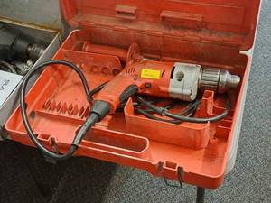 lot 582 image: Milwaukee Magnum Holeshooter 12 Drill 235-1 with Case and Black Side Handle