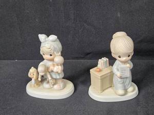 lot 57 image: Set of 2 Precious Moments Figurines School Girl and Girl with Puppies