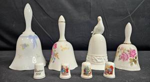 lot 89 image: Collection of 4 Hand-Painted Porcelain Bells and 4 Avon Holiday Thimbles