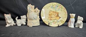 lot 108 image: Kitty-Themed Collectible Figurines, Plate, and Calendar Set