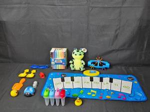 lot 137 image: Childrens Toy Collection Musical Mat, Frog Plush, Chalk, and Assorted Toys