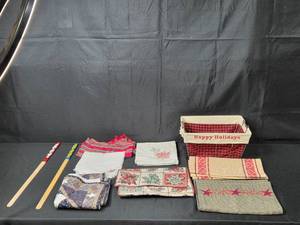 lot 146 image: Collection of Holiday-Themed Basket, Table Linens, and Decorative Sticks