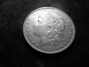 lot 14 image: 1884 O Morgan Silver Dollar