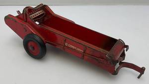 lot 52 image: 1950s Pressed Metal MccORMICK 116 Scale Deering Tractor Spreader