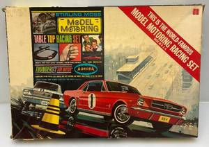 lot 77 image: 1964 AURORA Stiring Moss Model Motoring Tasble Top Racing Set Thunder Jet 500 Motor HO Slot Car Track In Original Box (Has Cars But Original Cars Missing)