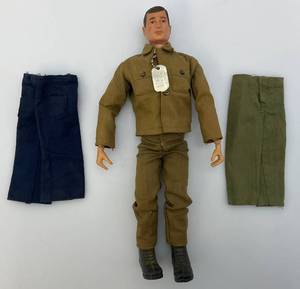 lot 83 image: 1964 GI Joe 12 Action Soldier Figure With Fatigue Outfit Scar Brown Hair