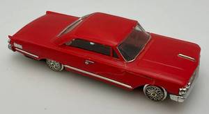 lot 100 image: 1960s MOTORIFIC Battery Operated Mercury Two Door (Needs Rubber On Wheels)