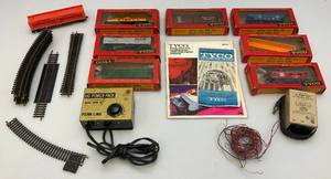 lot 107 image: 1960s TYCO HO Train Cars In Original Boxes With Transformer, Track & More