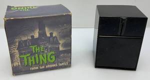 lot 115 image: 1964 Filmways Brands The THING From ADAMS FAMILY Bank In Original Box (Untested) Battery Box Very Clean