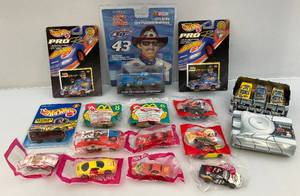 lot 125 image: Misc. NASCAR Collectibles Including Miniature Die-Cast Cars, Racing Champions Richard Petty And More (NIB)
