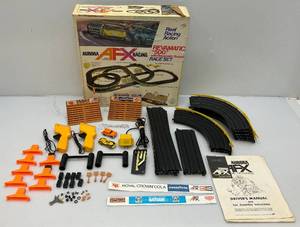 lot 203 image: Vintage Aurora AFX Racing REVAMATIC 500 With Revamatic Sound HO Race Set And Cars (CARS ARE NOT ORIGINAL TO SET)