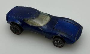 lot 241 image: 1968 Hot Wheels Redline Torero  Dark Blue Transparent, White Interior Good Condition (Tires Need Straightening)