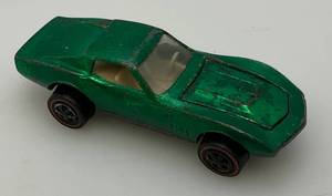 lot 249 image: 1968 Hot Wheels Redline Custom Corvette  Transparent Green, White Interior Good Condition (Tires Need Straightening)