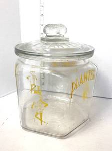 lot 70 image: Vintage Yellow Planters Mr. Peanut Counter Jar  Lid