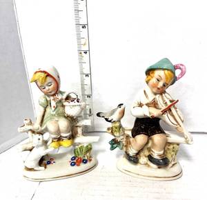 lot 93 image: German Boy and Girl Figurines