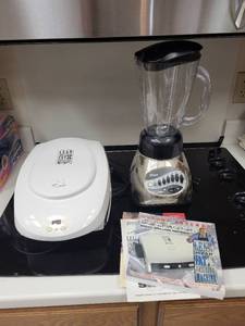 lot 248 image: Oster 12-Speed Blender and George Foreman Lean Mean Fat Grilling Machine Set