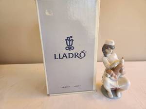 lot 236 image: Lladr Nurse with Puppy Porcelain Figurine