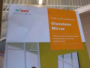 lot 206 image: Glass Less Mirror 44 x 63 has a sl...