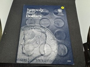 lot 96 image: Partially Complete Book of Kennedy Halfs