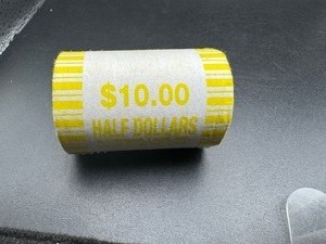 lot 99 image: Unopened Fed Roll Kennedy Half Dollars
