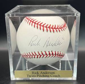 lot 26 image: Rick Anderson (Minnesota Twins Pitching Coach) Signed Baseball Rawlings OMLB Selig Ball w cube and plaque
