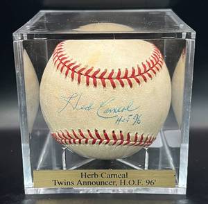 lot 40 image: Herb Carneal (HOF Minnesota Twins Announcer) Signed and Inscribed HOF 96 Baseball Rawlings OMLB Selib Ball w cube and plaque