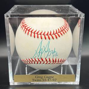 lot 52 image: Greg Gagne (Minnesota Twins SS 1987-92) Signed Baseball Rawlings OALB Brown Ball w cube and plaque