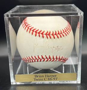 lot 61 image: Brian Harper (Minnesota Twins Catcher 1988-93) Signed Rawlings OALB Brown Ball w cube and plaque