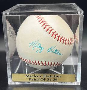 lot 62 image: Mickey Hatcher (Minnesota Twins OF 1981-86) Signed Vintage Wilson Baseball w cube and plaque