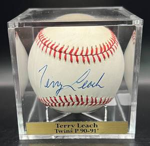 lot 72 image: Terry Leach (Minnesota Twins Pitcher 1990-91) Signed Vintage MacGregor  Baseball w cube and plaque