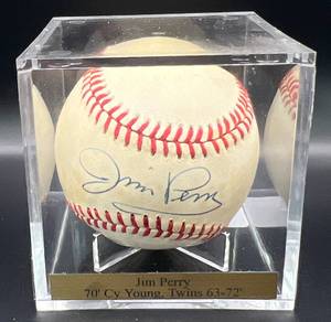 lot 88 image: Jim Perry (Minnesota Twins Pitcher and Cy Young Winner 1963-72) Signed Rawlings OALB Brown Baseball w cube and plaque