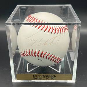 lot 106 image: Terry Stenbach (Minnesota Twins Catcher 1997-99) Signed Rawlings OALB Budig Twins Baseball w cube and plaque
