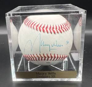 lot 114 image: Maury Wills (Los Angeles Dodgers SS) Signed Rawlings ONLB Baseball w cube and plaque
