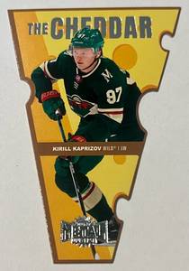 lot 251A image: Kirill Kaprizov 2021-22 NHL Metal Universe #TC-7 The Cheddar Minnesota Wild Hockey Card