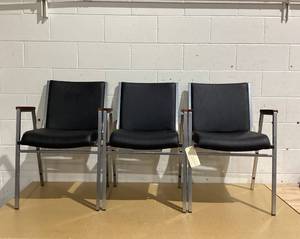 lot 604 image: LOT OF 3 HERCULES Series Heavy Duty Black Vinyl Stack Chair with Arms