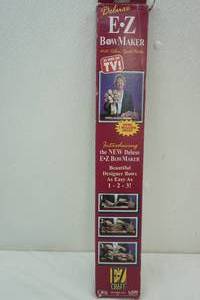 lot 108 image: As Seen on TV E Z Bow Maker with ribbon spool holder